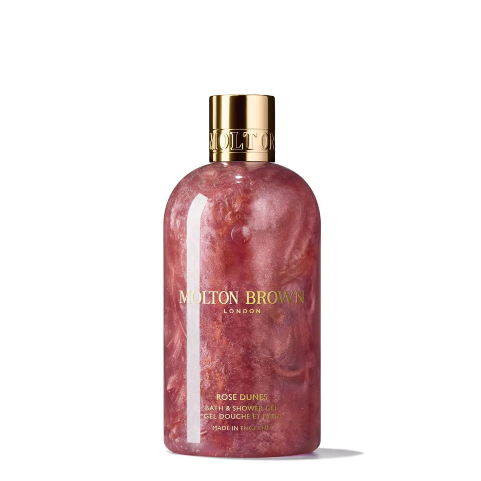 Molton Brown Rose Dunes front bottle showing shimmering amber-rose scent and luxurious cleanse