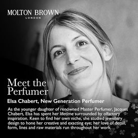 Molton Brown bottle styled on towel conveying luxurious bathroom routine