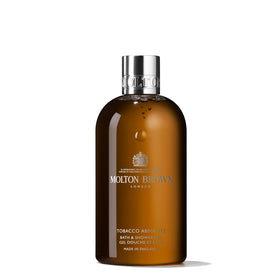 Molton Brown front packaging showing elegant bottle and woody scent