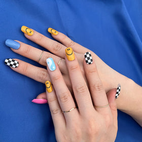 MOMSON applying a strip to nail for precise, easy placement