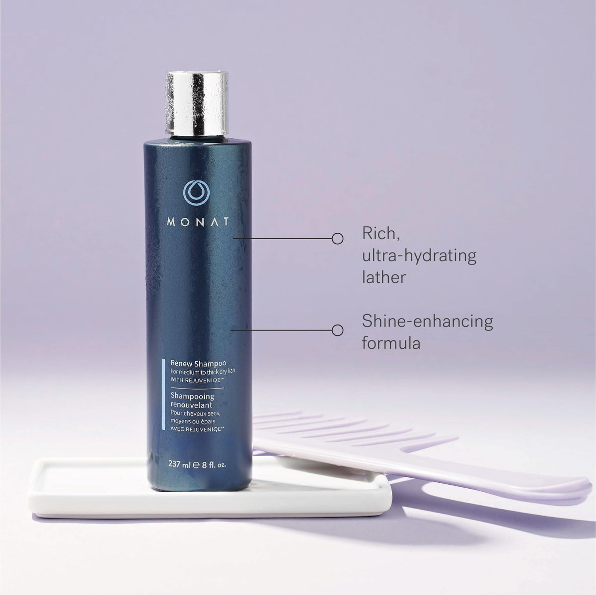 MONAT Renew Shampoo bottle in hand for scale and easy usage indication