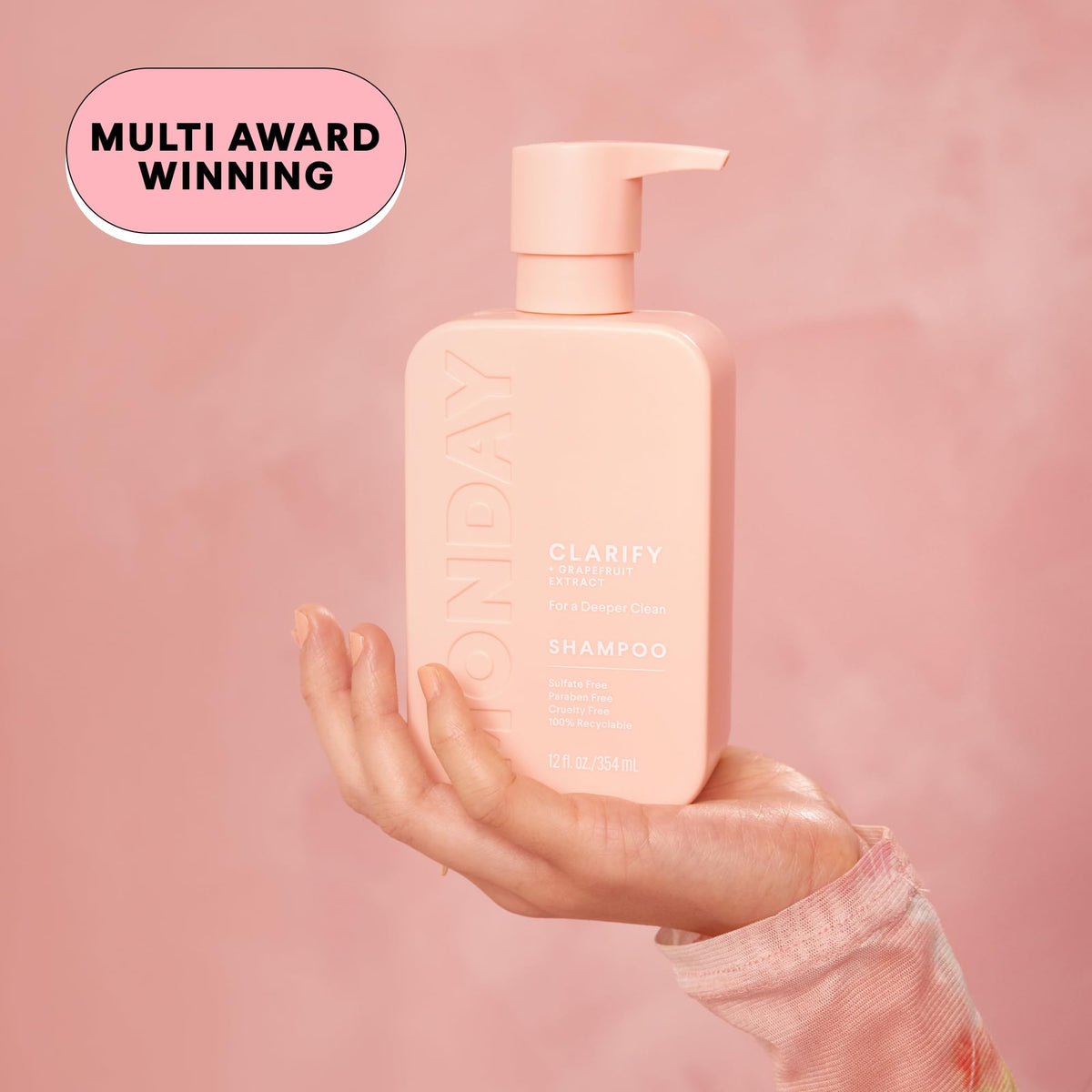 MONDAY HAIRCARE conditioner bottle squeezed to show smooth creamy texture and detangling
