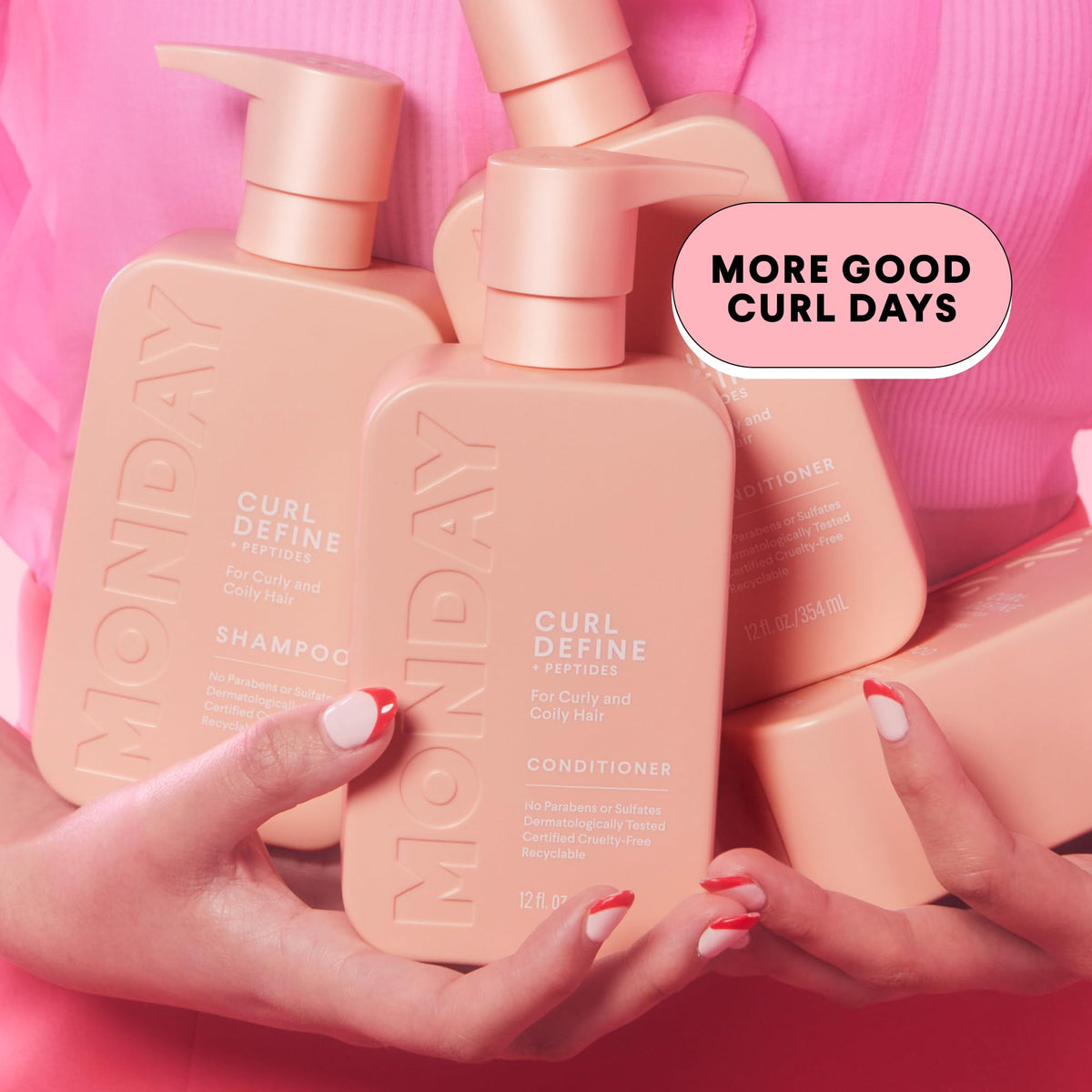MONDAY HAIRCARE in-shower use with hands applying product to curls