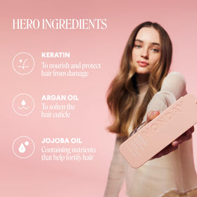 MONDAY HAIRCARE bottles held in hand demonstrating travel-ready size and convenience