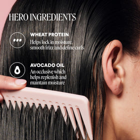 MONDAY HAIRCARE 90 mL bottles held in hand to show compact travel-friendly size benefit