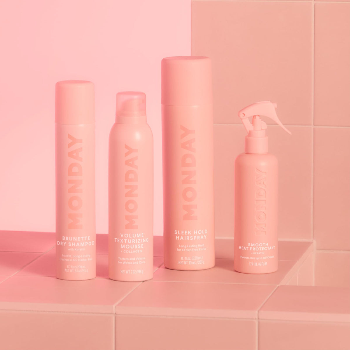 MONDAY HAIRCARE on bathroom shelf with styling tools conveying daily routine benefit