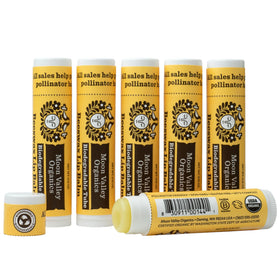 Moon Valley Organics front packaging showing six Sweet Honey lip balm sticks and benefits