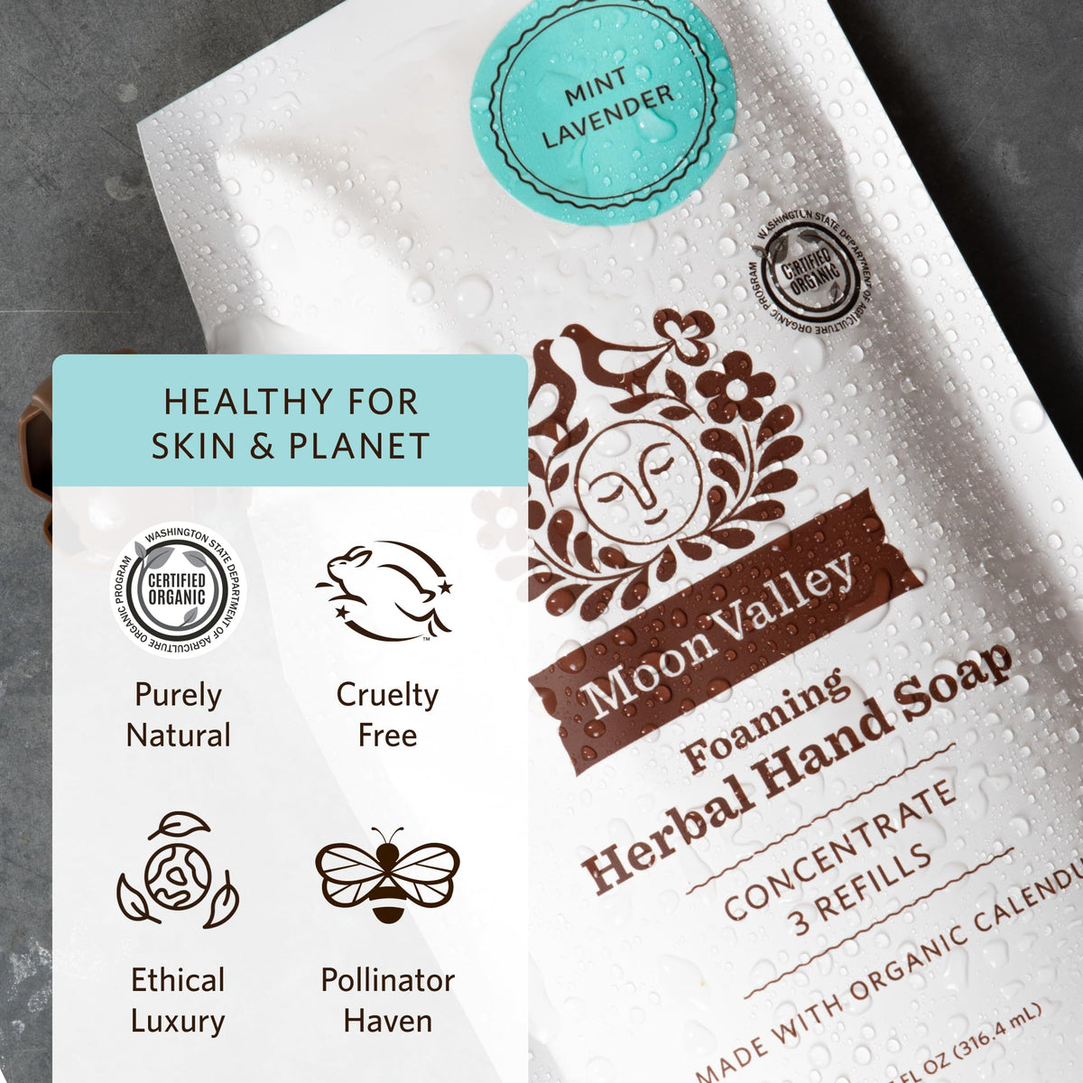 Moon Valley Organics pouch beside dispenser to show refill capacity