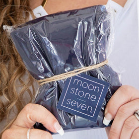 MoonstoneSeven scale with hand showing size and portability benefit