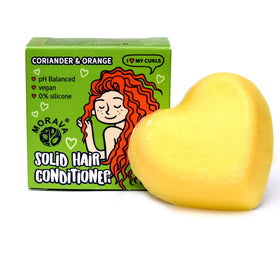 Morava conditioner bar next to travel kit showing compact size and plastic-free convenience