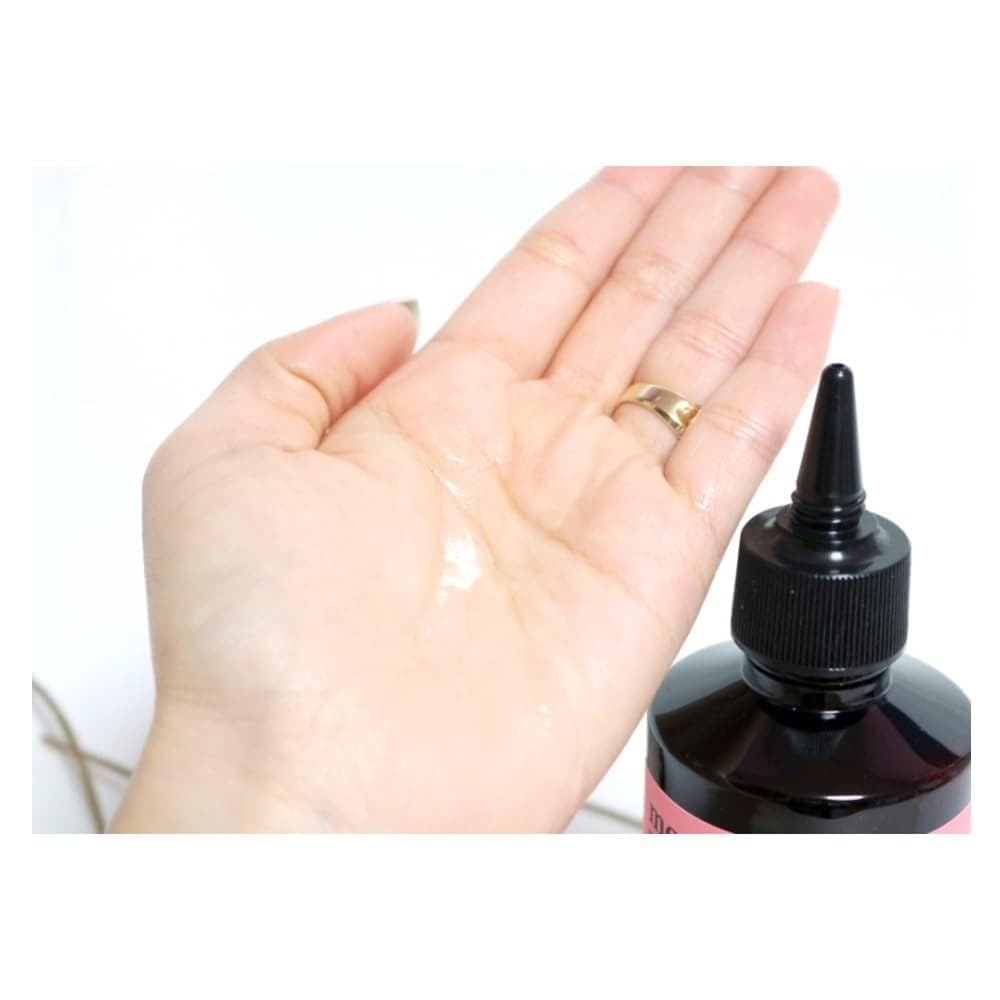 MOREMO product being applied to palm ready for even hair distribution benefit