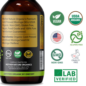 Mother Nature Organics 4oz bottle held in hand to show scale and travel-friendly size