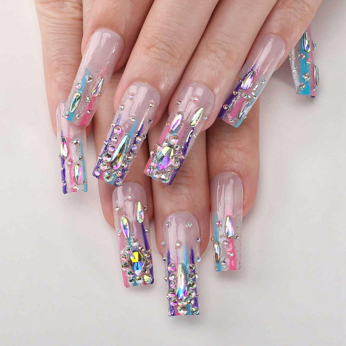MqpQ front packaging showing full kit and glossy long square nails for quick glam