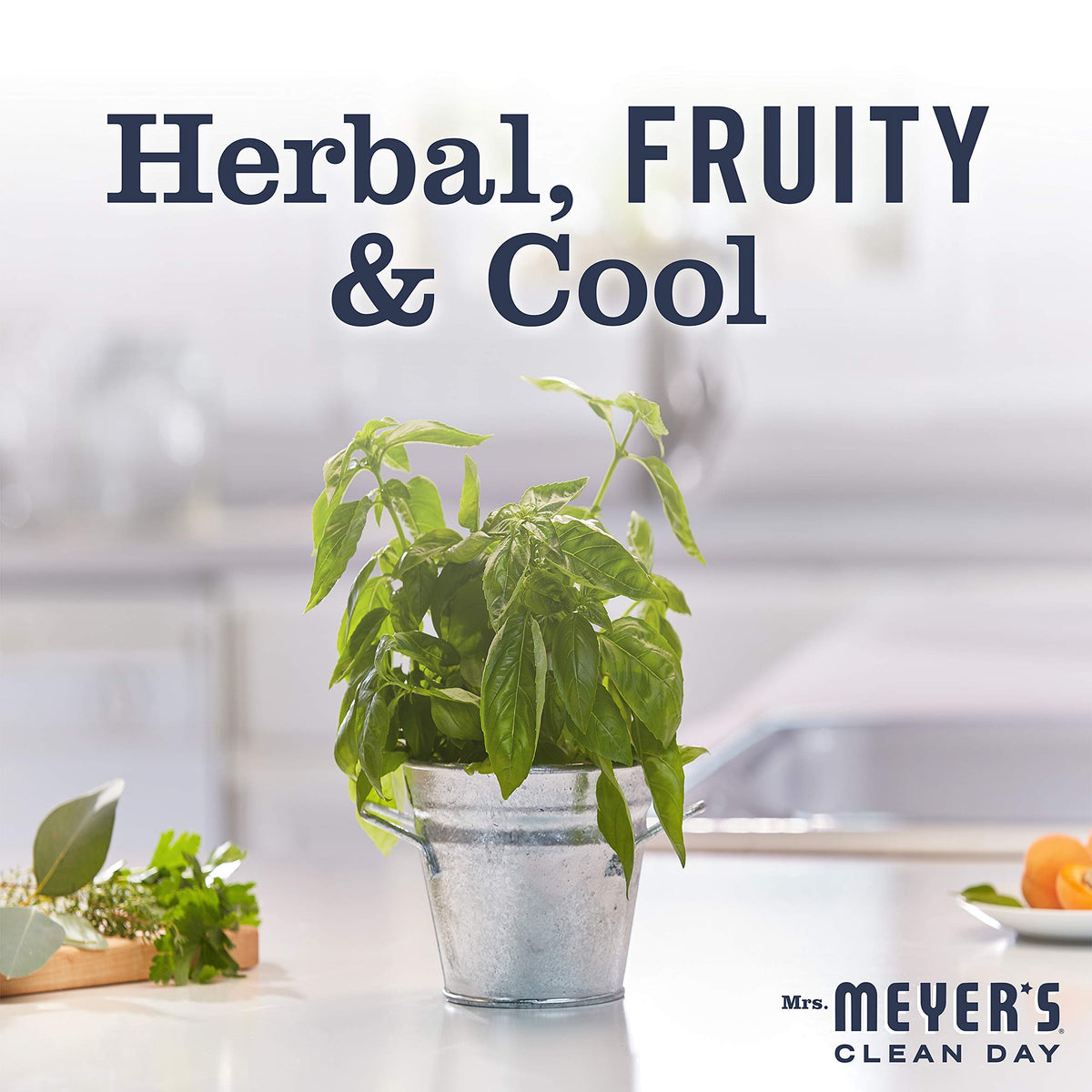 Mrs. MEYER'S basil bottle on kitchen sink conveying fresh herbaceous fragrance benefit