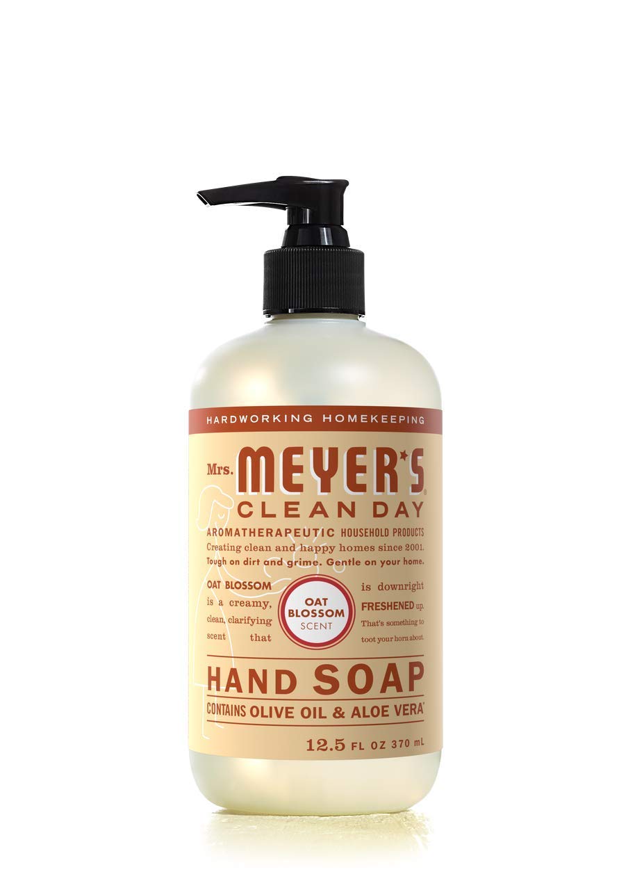 mrs. meyer's basil bottle staged at kitchen sink showing herbaceous freshness benefit
