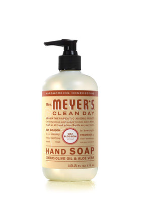 mrs. meyer's basil bottle staged at kitchen sink showing herbaceous freshness benefit
