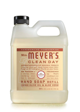 Mrs. MEYER'S pouring refill into dispenser for easy, waste-reducing transfer