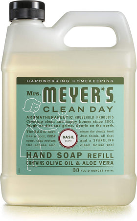 Mrs. MEYER'S pouring refill into dispenser demonstrating refill convenience and waste reduction
