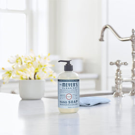 Mrs. MEYER'S bottle held in hand showing 12.5 fl oz scale and refill practicality