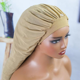 MsFan bonnet styled on pillow in bedroom demonstrating protective nightly use