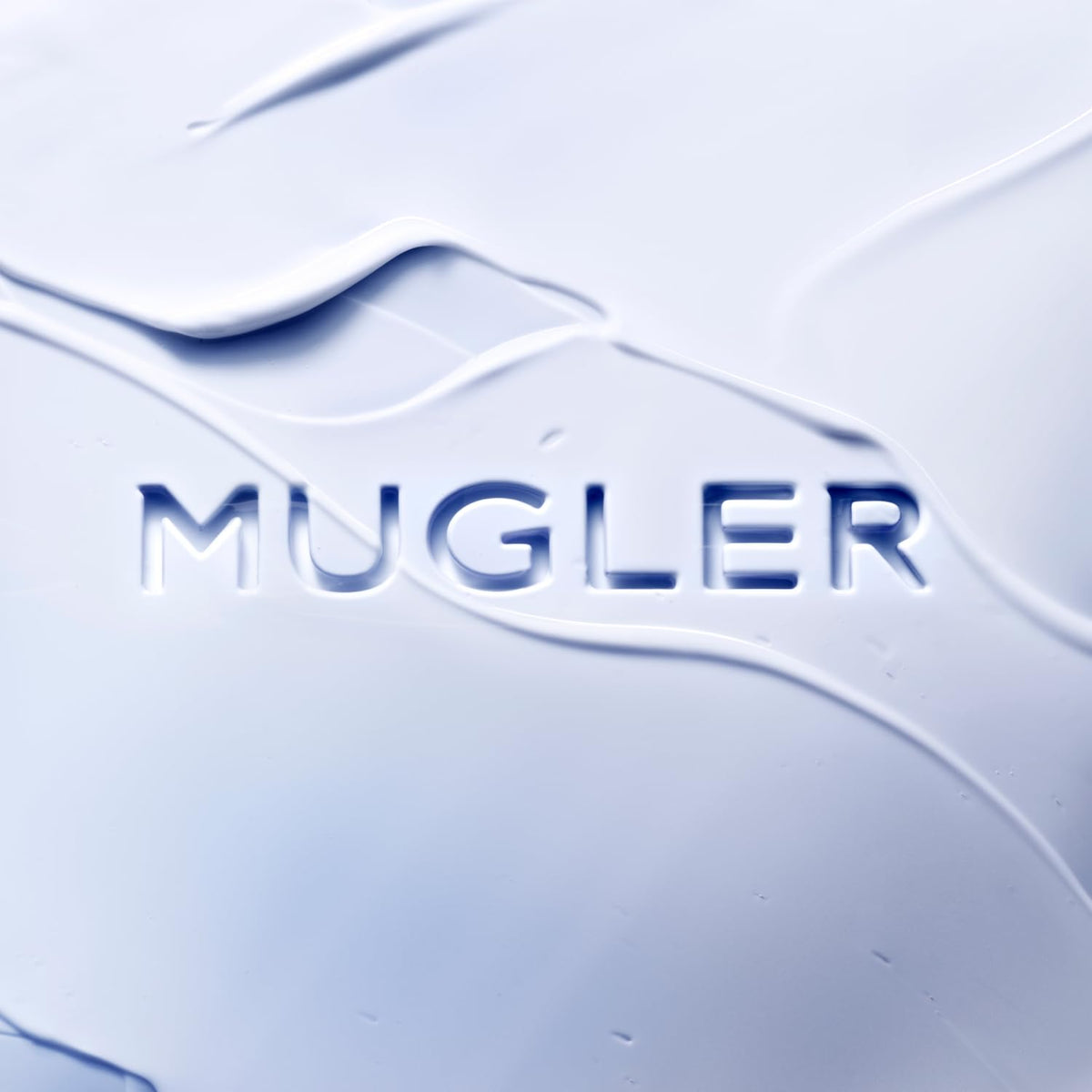 Mugler Angel lotion texture close-up illustrating creamy hydration and absorbency benefit