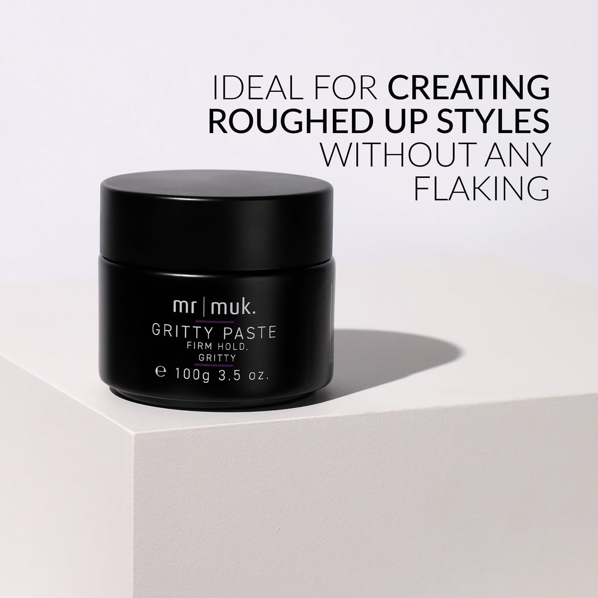 MUK paste scooped in hand ready to apply for strong hold styling