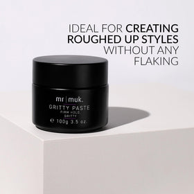MUK paste scooped in hand ready to apply for strong hold styling