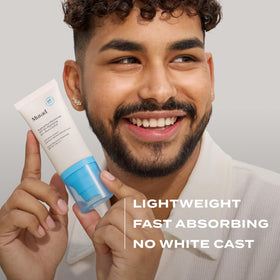 Murad tube beside ingredient callouts showing salicylic acid and sunscreen components