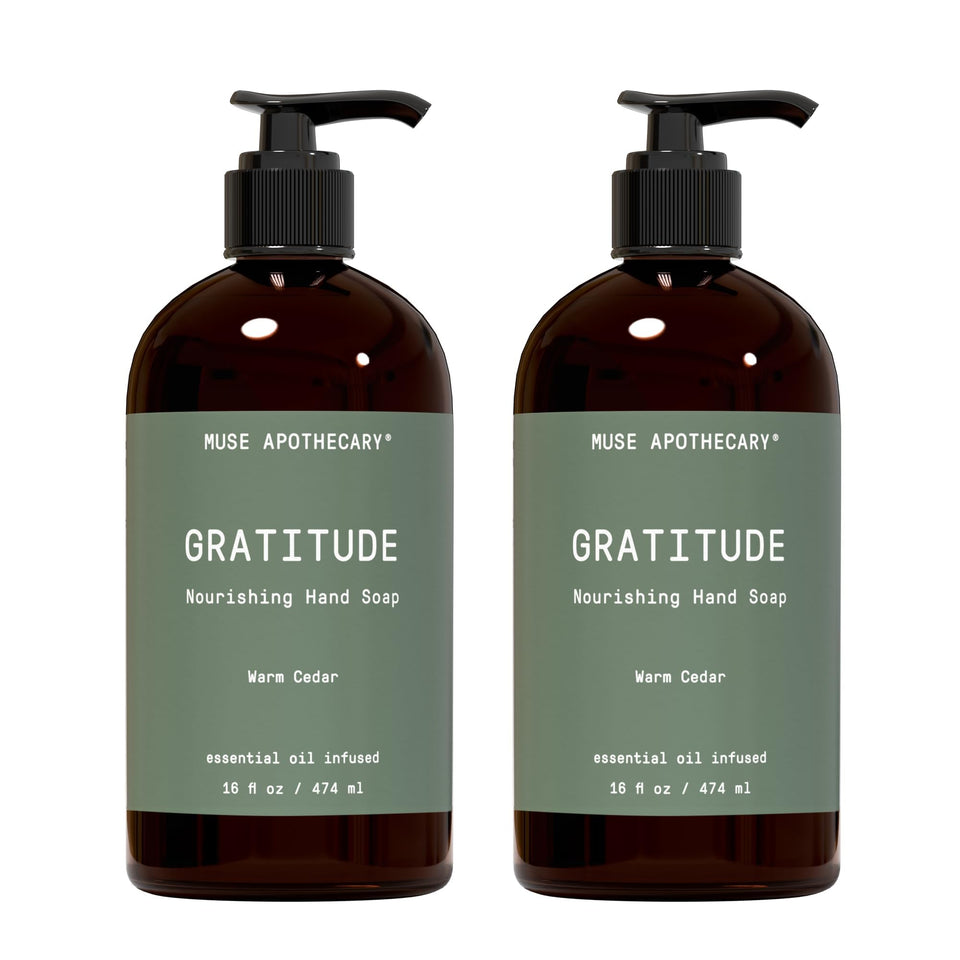 Muse Apothecary front packaging showing Warm Cedar 16 oz bottle and calming scent benefit