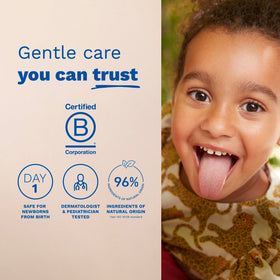 Mustela bottle held in hand to show 6.76 fl oz scale and travel-friendly convenience for parents
