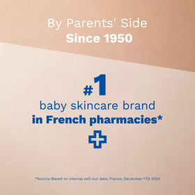 Mustela nourishing stick held in hand showing compact travel-friendly size