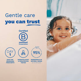 Mustela bottle beside baby bathtub showing gentle cleansing for sensitive skin