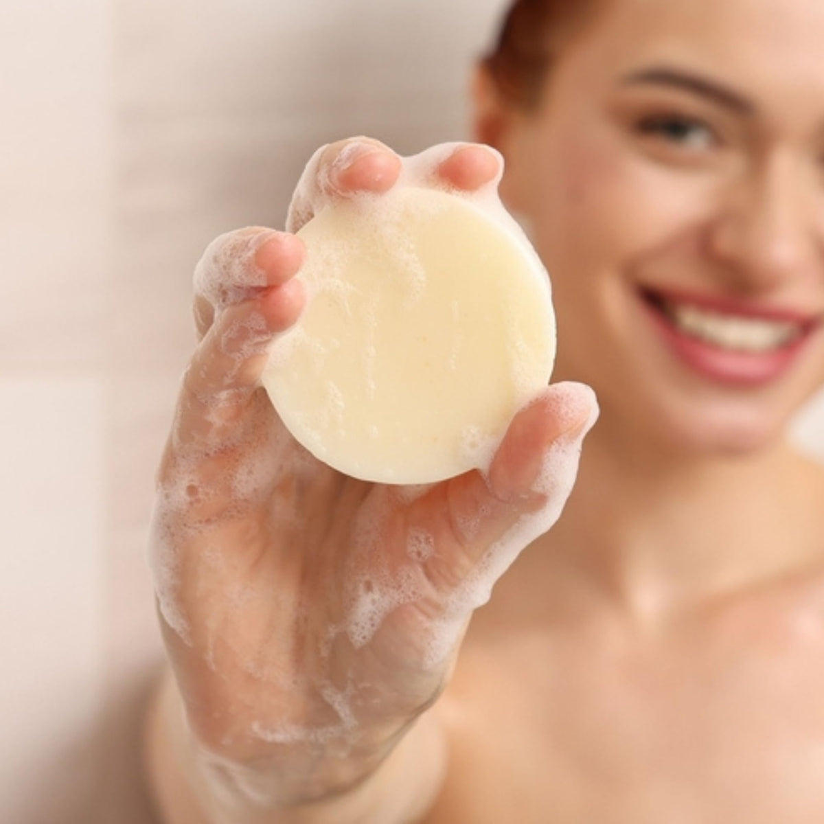 Muun two solid conditioner bars stacked to show compact, plastic-free design