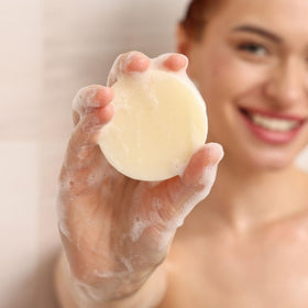 Muun two solid conditioner bars stacked to show compact, plastic-free design