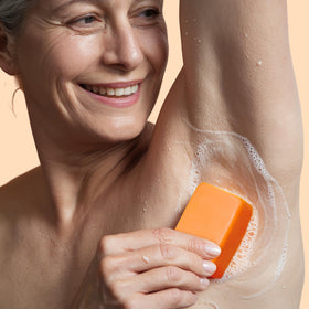 Muun soap lather on underarm demonstrating gentle deodorizing action for sweat-prone areas