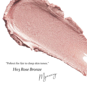 MYMERRY swatch on wrist showing buildable rose-bronze-gold sheen for color reference