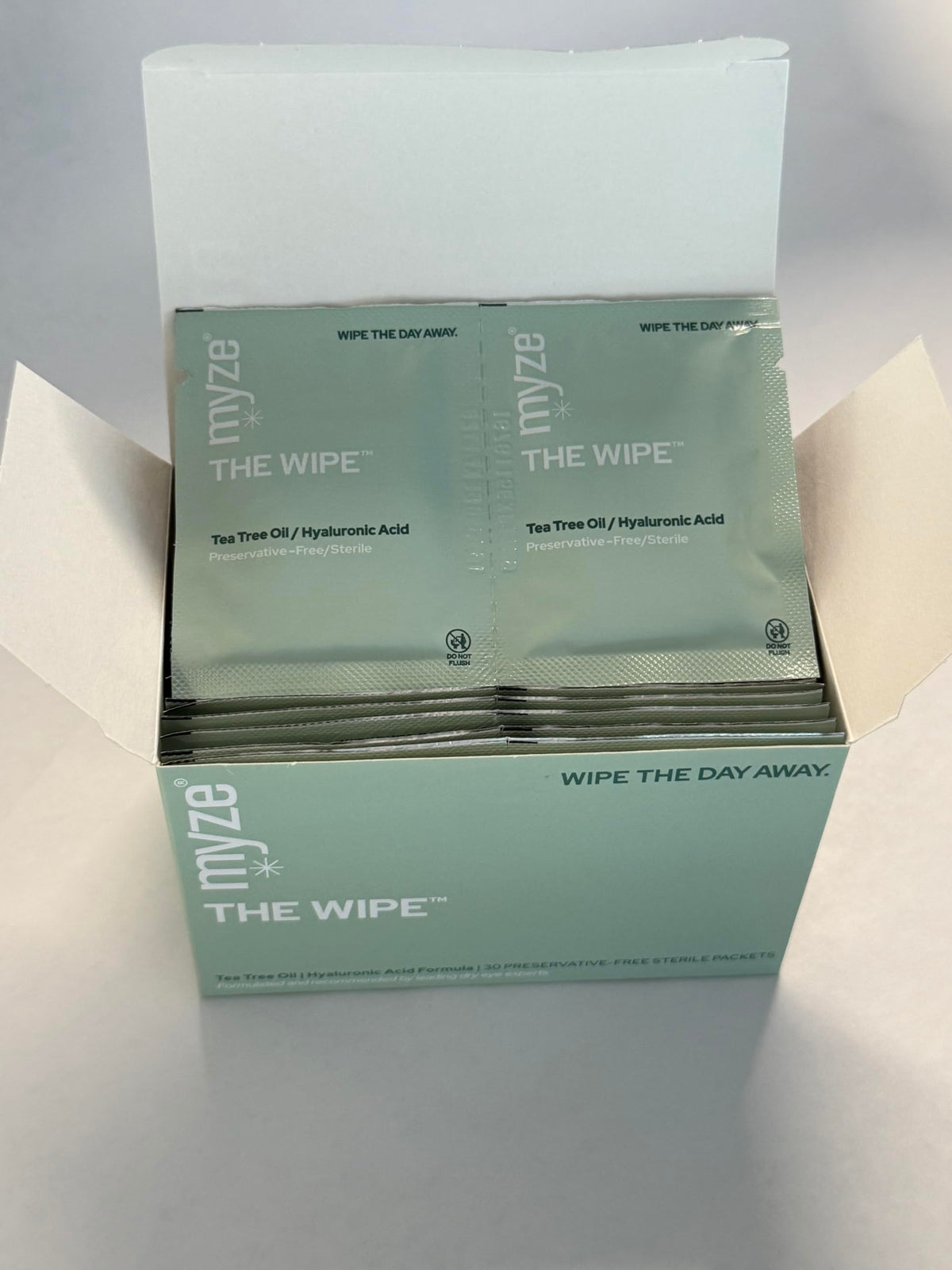 Myze The Wipe ingredients label close-up highlighting tea tree and hyaluronic hydration benefits
