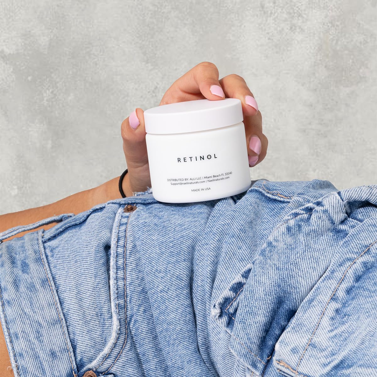 NAELI in bathroom setting as part of a night routine for firmer-looking skin