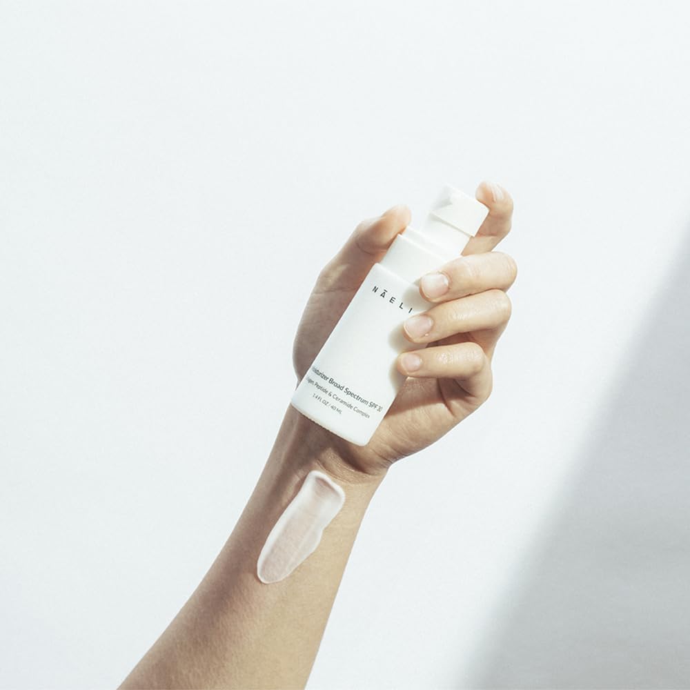 NAELI size shown in hand to illustrate 1.4 oz travel-friendly convenience