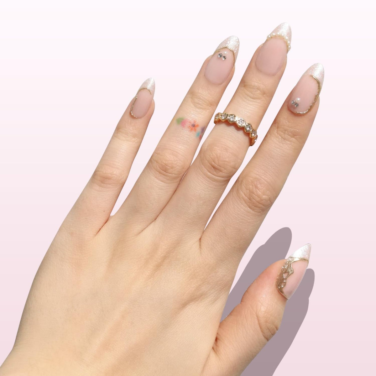 Nail Reformation pearl and gem detail highlighting refined embellishment and snag-resistant finish