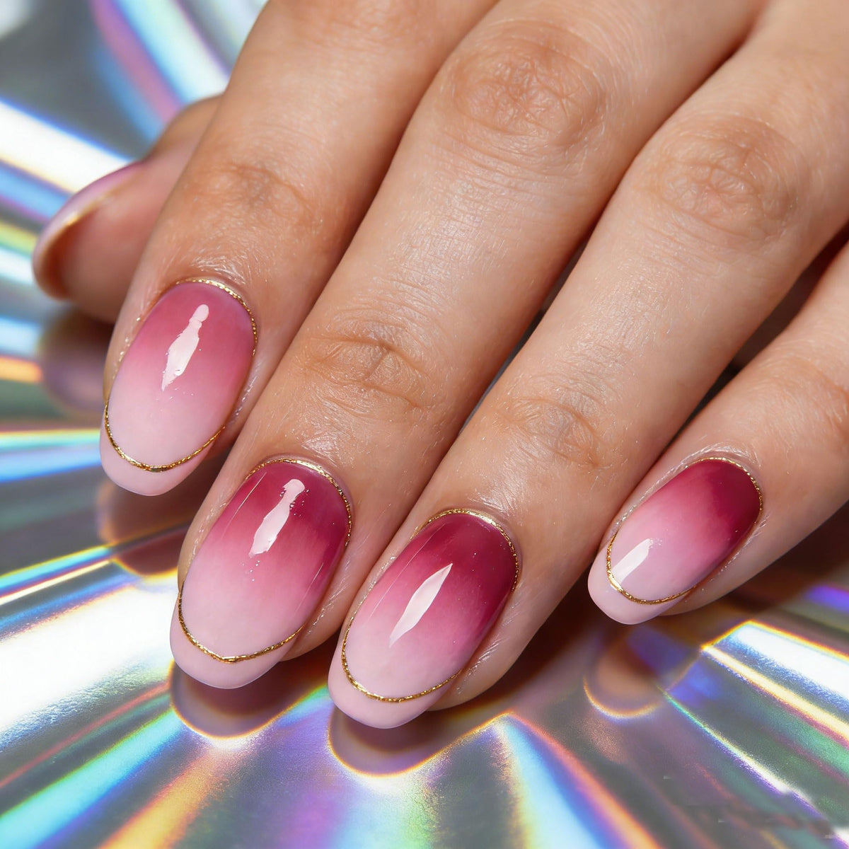 NAIL GIL kit next to hands to show compact size and travel-ready kit
