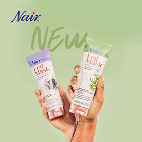 Nair leg mask tube next to a hand illustrating the 8-ounce tube size and scale