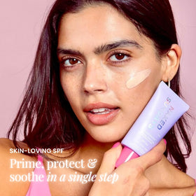 Naked Sundays tube in hand illustrating 50ml size and portability