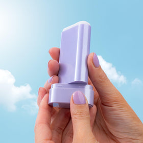 Naked Sundays stick tucked inside travel pouch illustrating leak-free, TSA-friendly carry