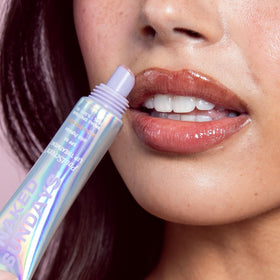 Naked Sundays Midnight Kiss swatch on hand shows sheer buildable color
