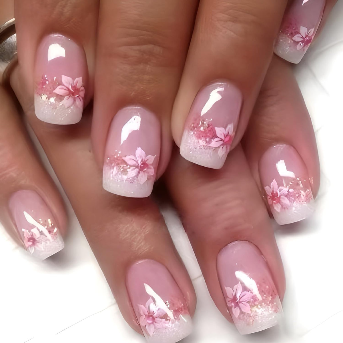 Namrec lifestyle image of woman wearing daisy press-ons for an elegant outfit