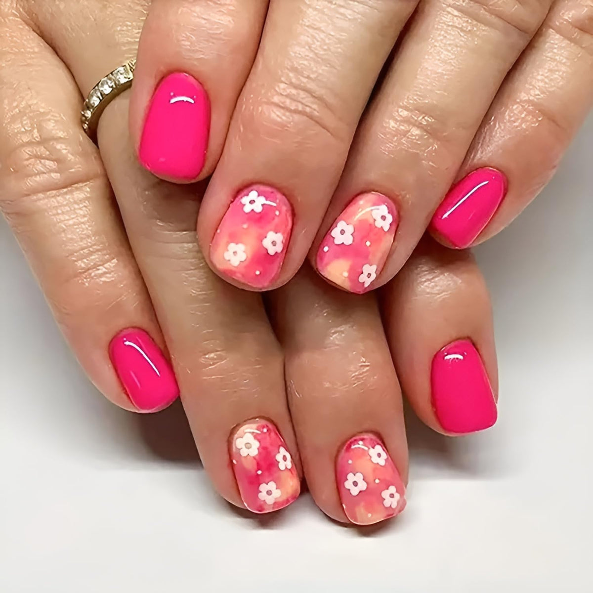 Namrec removing press-on nail after warm soak to show gentle, reusable removal