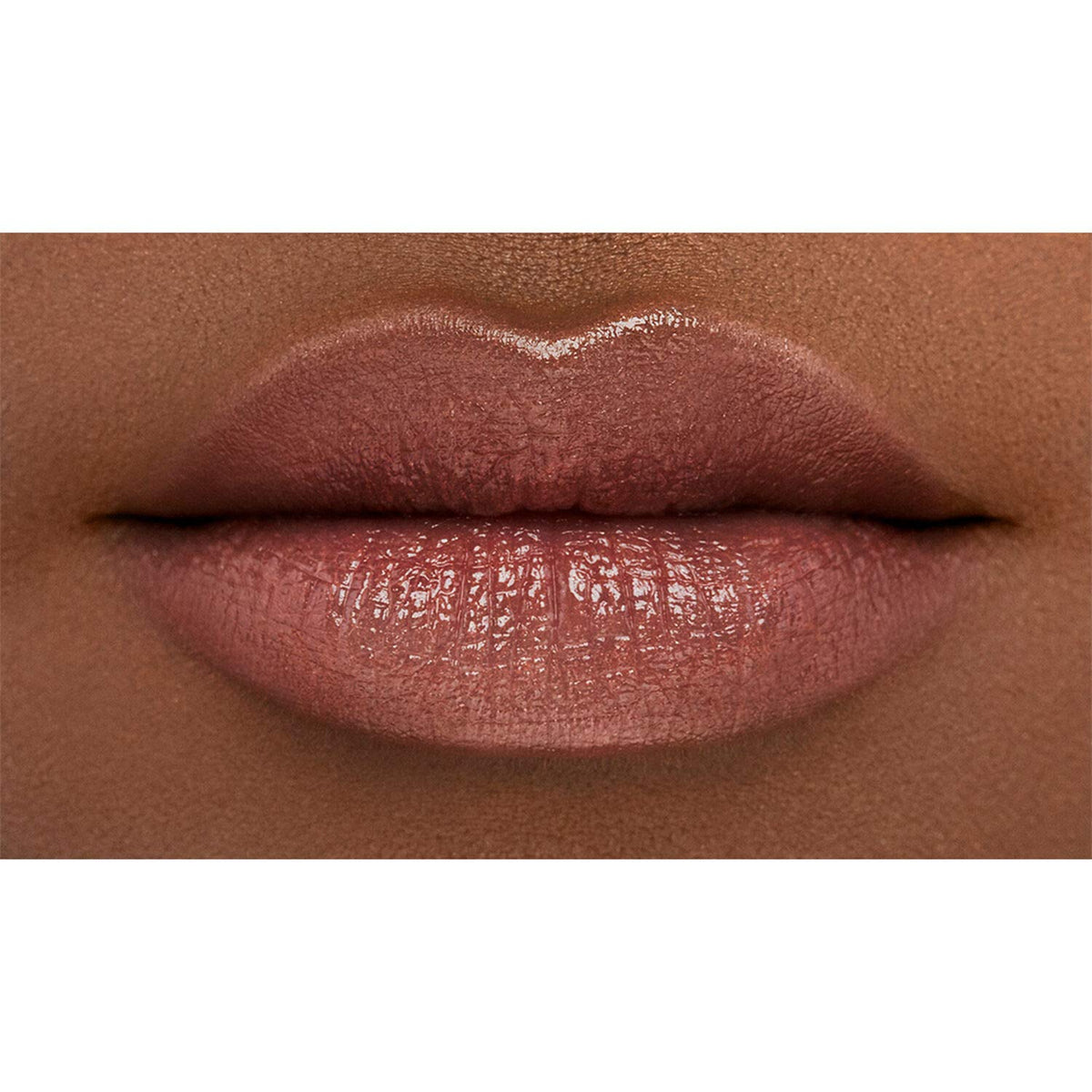 NARS swatch on arm showing peachy-pink shimmer and color-build benefit