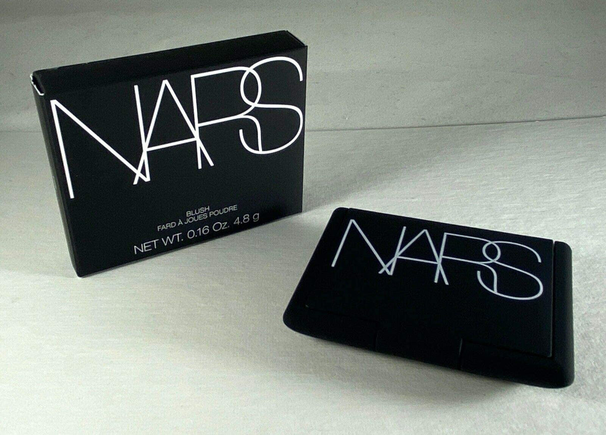 NARS Orgasm swatch on skin showing peachy-pink shimmer and natural radiance