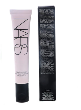 NARS primer next to coin for size comparison and travel-friendly benefit